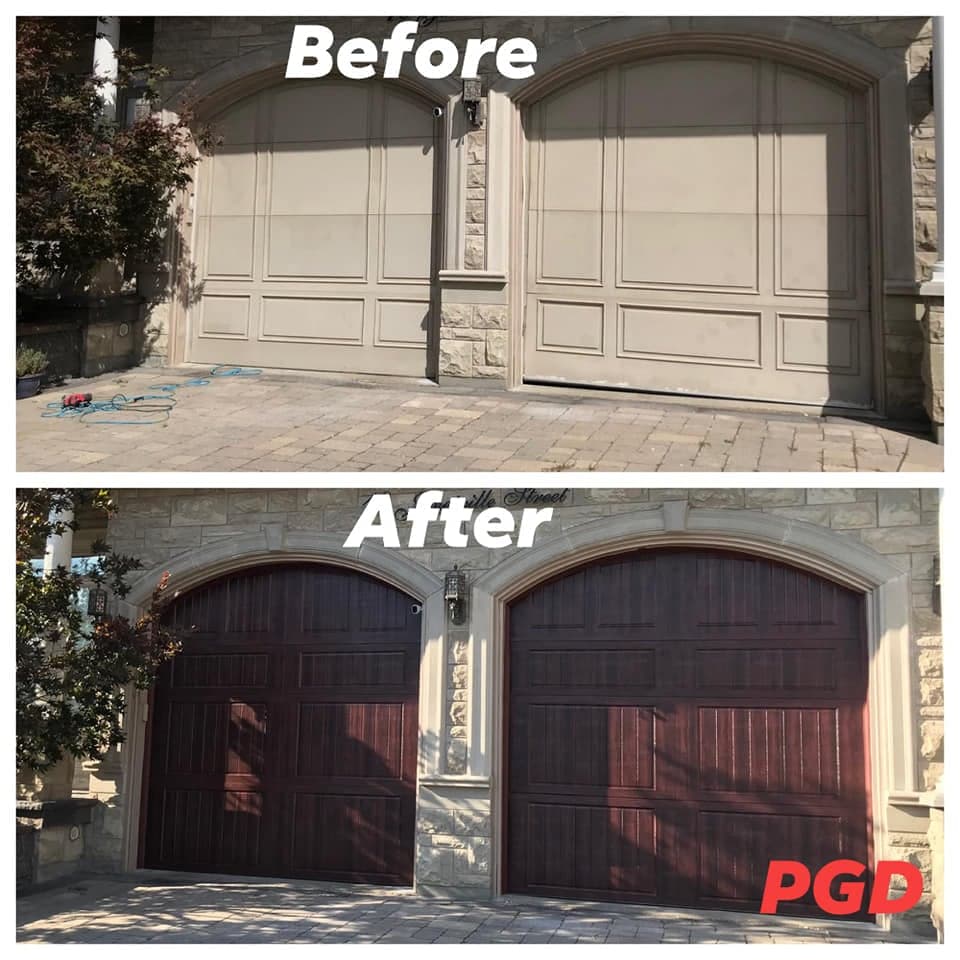 Before and after: two arched beige garage doors with plain panels in a stone front, replaced with two arched dark woodgrain doors with vertical plank detail.