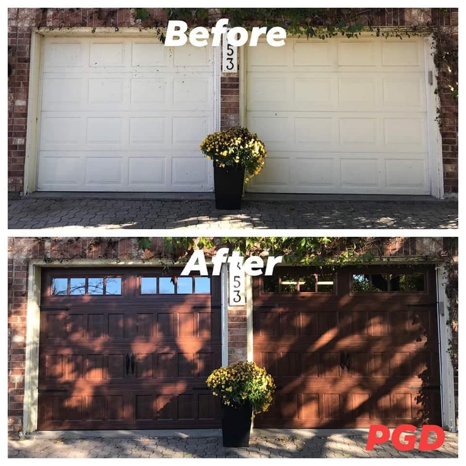Before and after: two cream raised-panel garage doors in a brick wall, replaced with two woodgrain carriage-style doors with windows along the top and black handles.