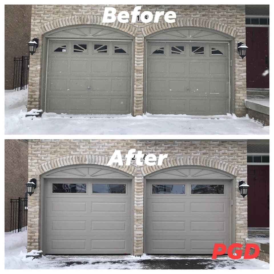 Before and after: two grey raised-panel garage doors with sunburst windows under brick arches, in snow, replaced with two grey long-panel doors with two windows across the top.