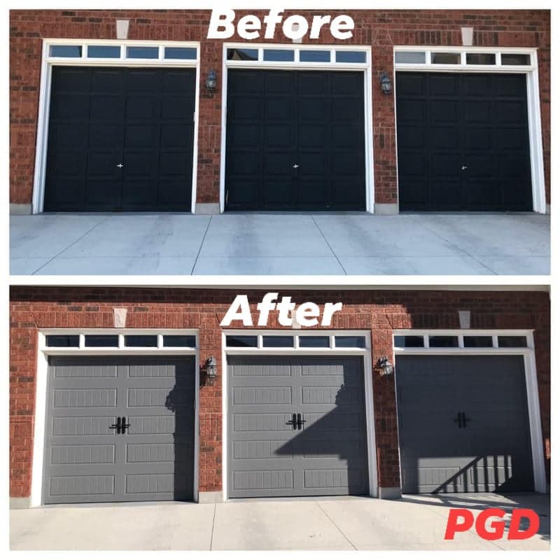 Before and after: three black raised-panel garage doors under transom windows in a red brick wall, replaced with three grey carriage-style doors with black handles.