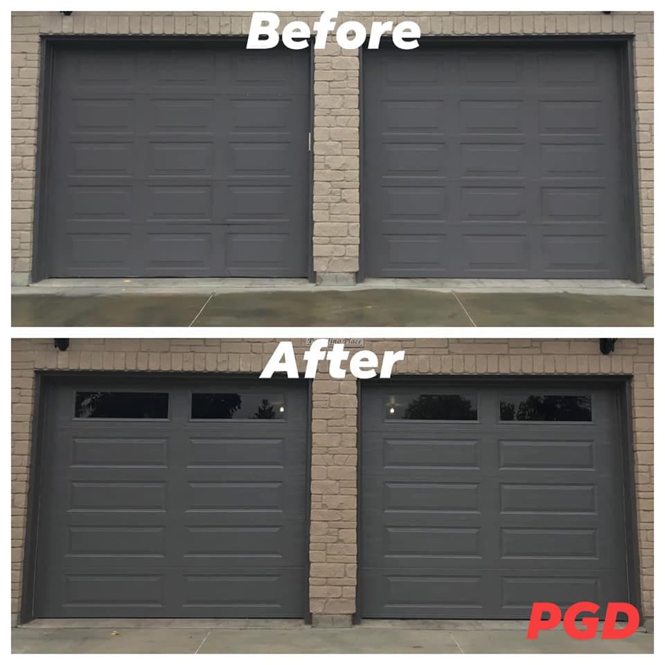 Before and after: two dark grey raised-panel garage doors in a brick wall, replaced with two dark grey long-panel doors with two windows across the top.