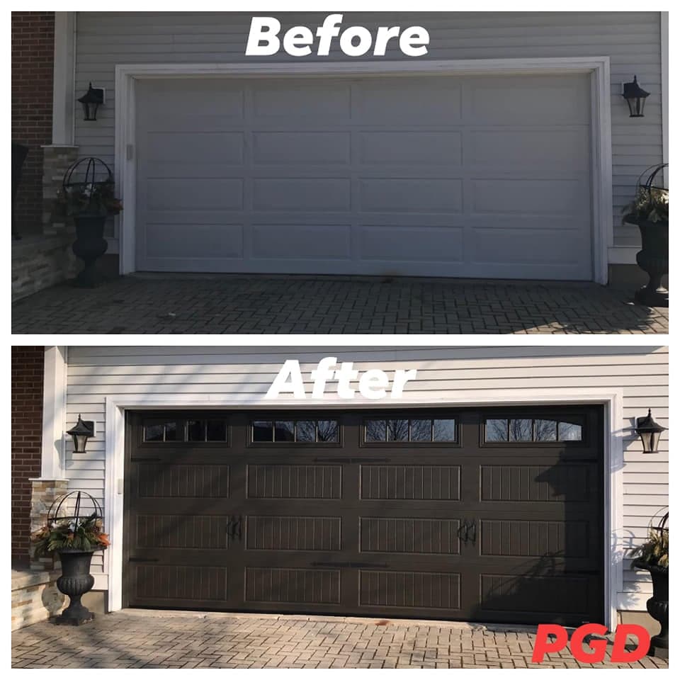 Before and after: a white raised-panel double garage door on a house with white siding, replaced with a dark brown carriage-style door with windows along the top, black handles and strap hinges.